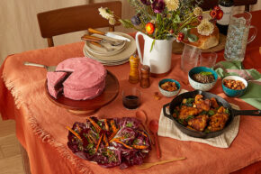 Fall dishes on a table draped in a festive orange tablecloth