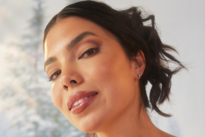 Girl looking into camera with holiday makeup look