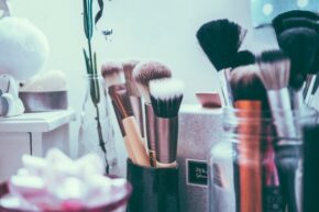 makeup brushes and products on counter