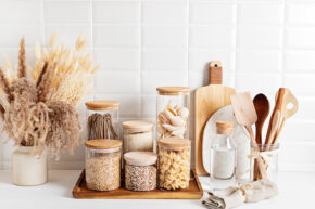 Organized pasta and grains in canisters on countertop