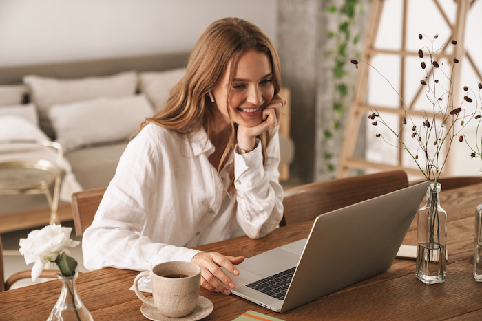 Girl sitting at desk looking at computer